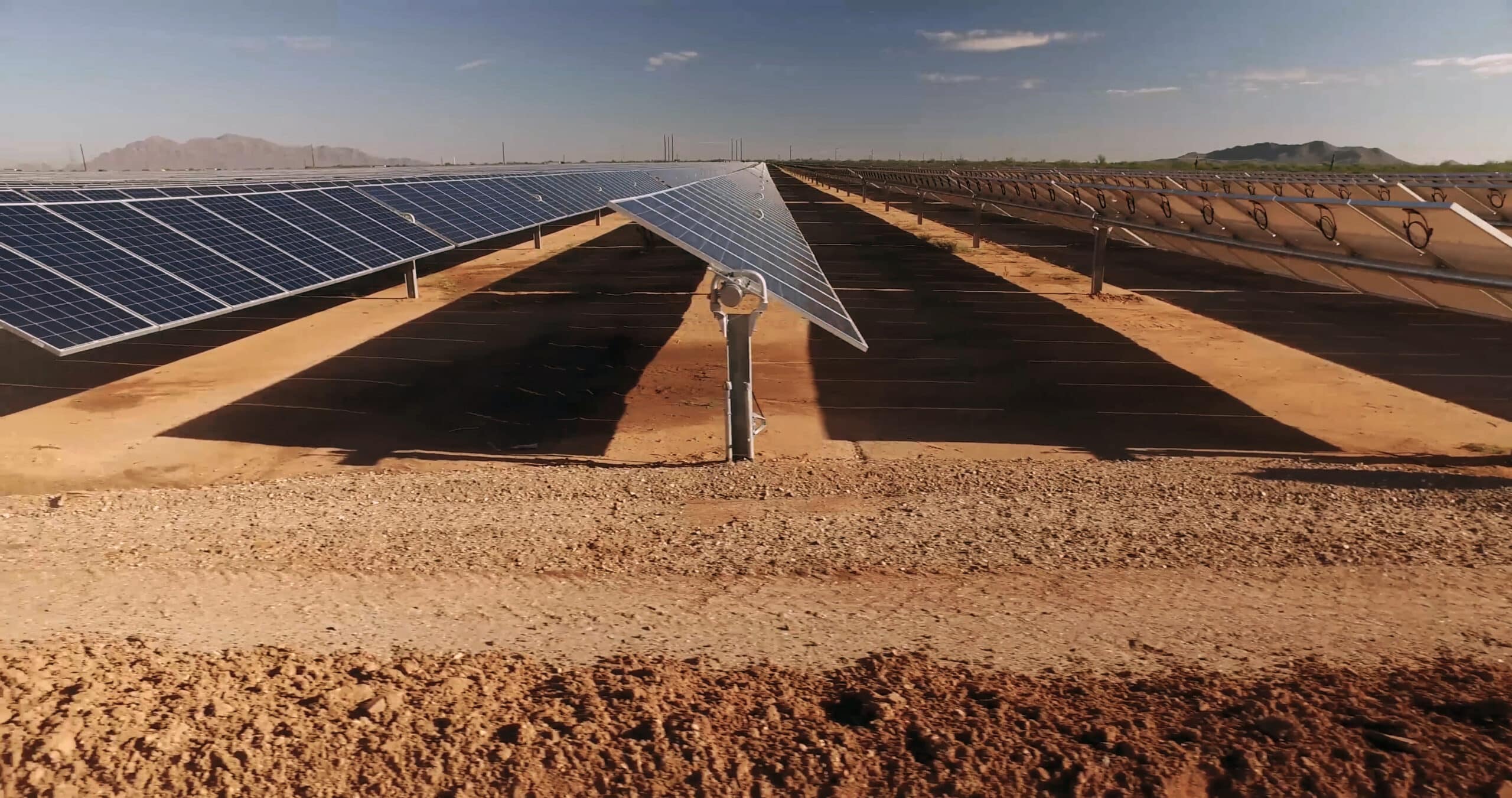 close up of solar power energy panels in the desert during a sunny day.